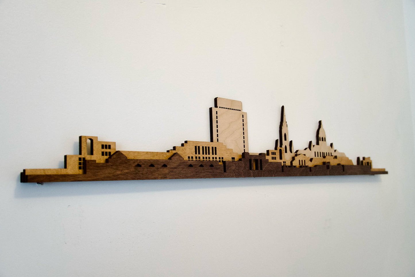 Artistic wooden cutout of University of Notre Dame's iconic campus landmarks.